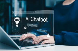 AI chatbot and conversational artificial intelligence concept. User interacting with AI chatbot on laptop with chat messages, automation tools, smart assistant technology for digital customer support